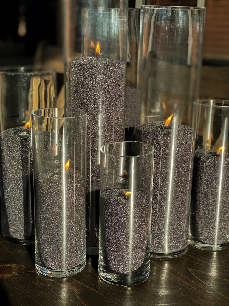 black wax candles set up for event
