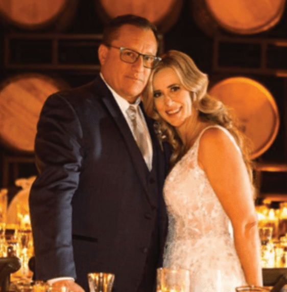 bride and father at wedding with candles set up on tables